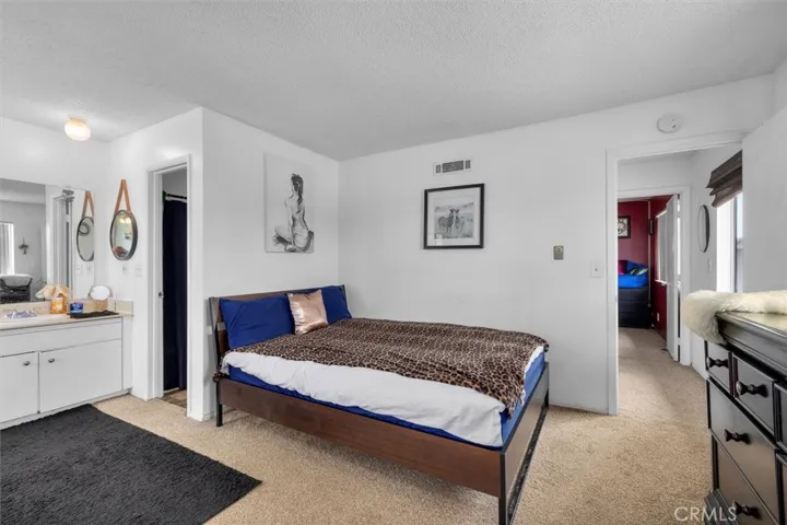 Unit B: Bedroom and vanity with sink