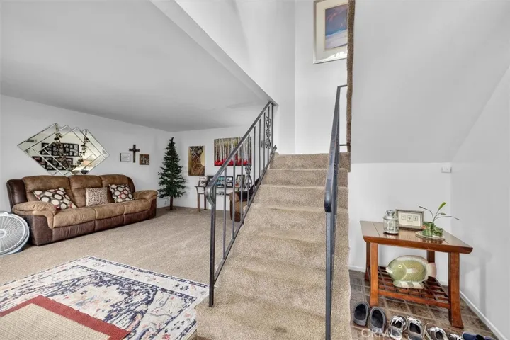 Unit B: Stairs to level two and front entryway
