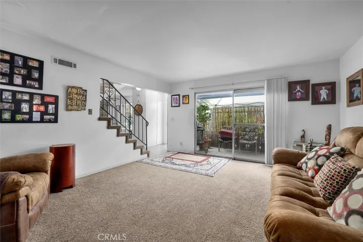 Unit B: Living space and view of patio