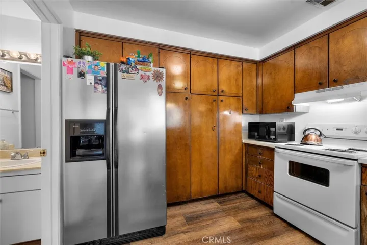 Unit B: Kitchen with ceiling to floor cabinets
