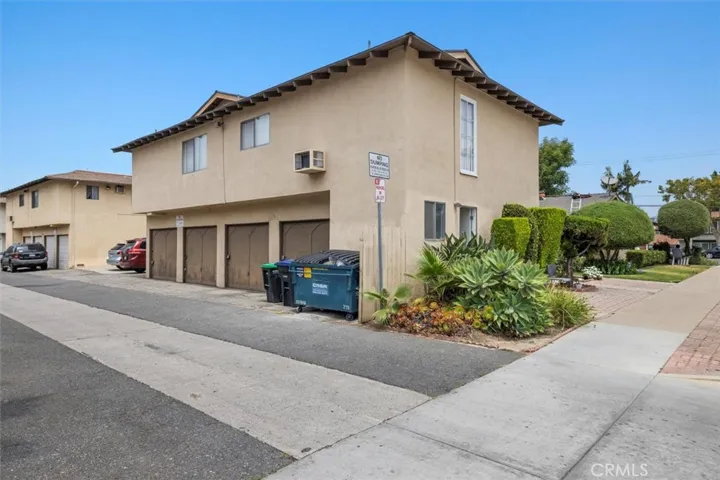 Four garages and 2 spaces, with access from alley behind the building