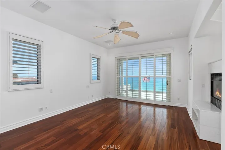 Primary bedroom with undescribable ocean views, sliders open to a large balcony/patio.  A marble double sided fireplace for the cool evenings.