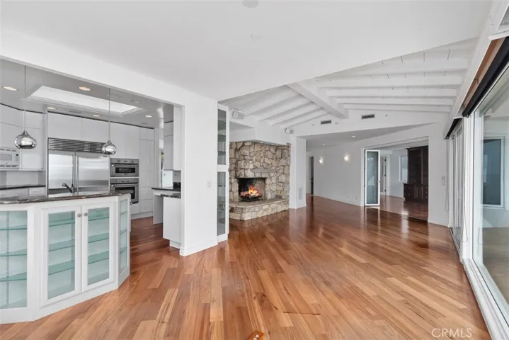 Kitchen is well thoughtout for those that love to cook.  High end appliances, floor to ceiling cabinets, pull outs, drawers, glass on glass picture window over the sink faces the white water and pier of San Clemente.