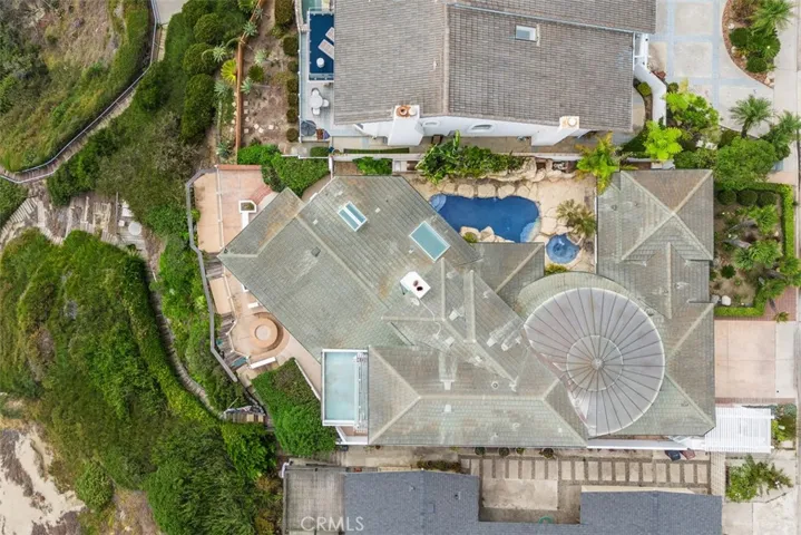 Overhead view o the property, left stairs to the ocean and views of three patio landings. From the front of the house you can see the turrett which has window around also with ocean views.