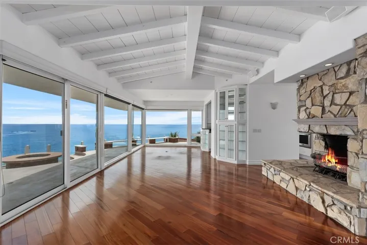 The outside patio has a fire ring with cement built in seating as well as addtional seating to capture the spectacualr views both north and south of this property.