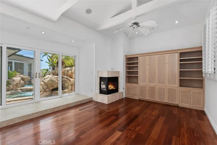 Extreamly large room with corner fireplace, one of four in the house.