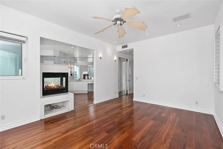 Two closets, one large walk-in to the left as you enter the room and a mirrored double door to the right as you enter the primary.  Both are fully lined with built-ins for shoes and different lenghts for haning gaments. The rainforest flooring is throughout the house with the exception of the entry with is travertine.