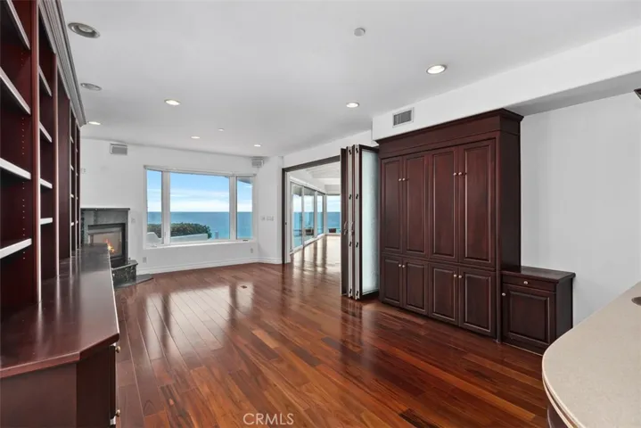 To the left in the picture is the wall bed and the accordian doors full opened.  These doors slide to close and can lock from within.