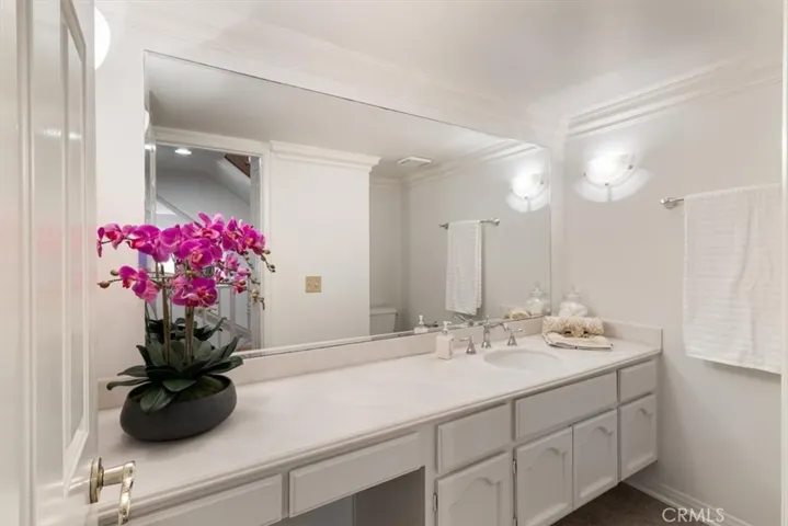 Stylish and convenient guest powder room—perfectly appointed for comfort and ease when entertaining.