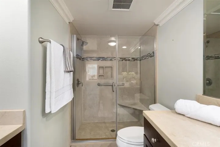 Beautifully appointed secondary bathroom featuring a sleek walk-in shower—stylish, spacious, and perfect for comfort and convenience.