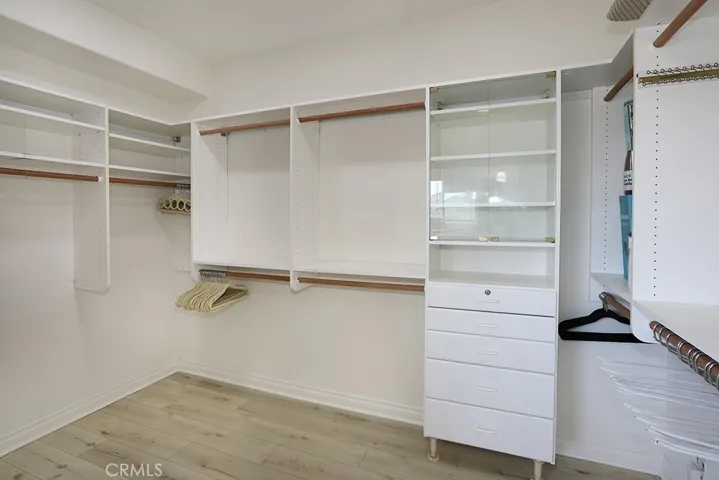 Primary bedroom walk-in closet