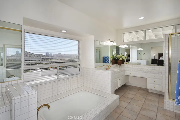 Primary bedroom tub and vanity