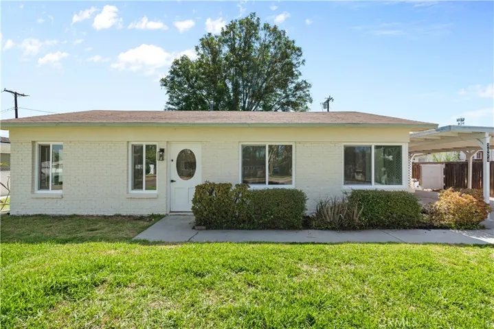 Front of house with yard in fg
