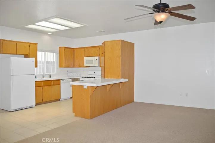 Efficient, U-Shaped Kitchen with Gas Range, Microwave, Dishwasher, Refrigerator Included, Large Pantry, & Skylight