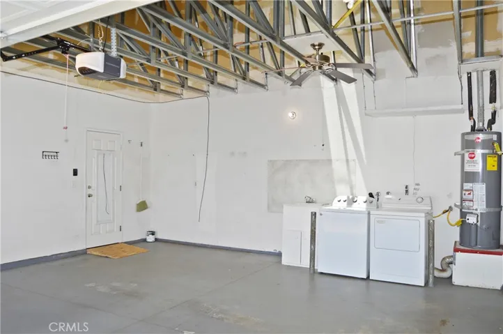 2-Car Garage with Opener, Washer, Dryer, Sink, Fan, Skylight, and Views of the Steel-Framed Construction and Radiant Heat Barrier Sheathing