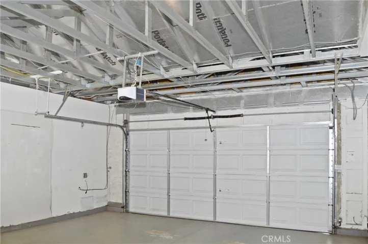 2-Car Garage with Opener, Washer, Dryer, Sink, Fan, Skylight, and Views of the Steel-Framed Construction and Radiant Heat Barrier Sheathing