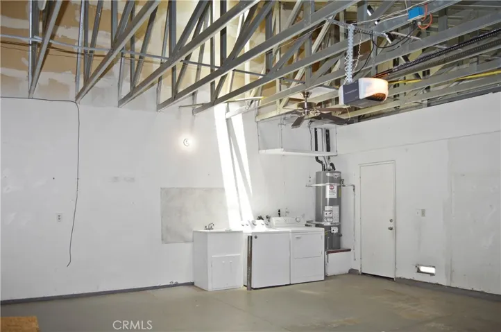 2-Car Garage with Opener, Washer, Dryer, Sink, Fan, Skylight, and Views of the Steel-Framed Construction and Radiant Heat Barrier Sheathing