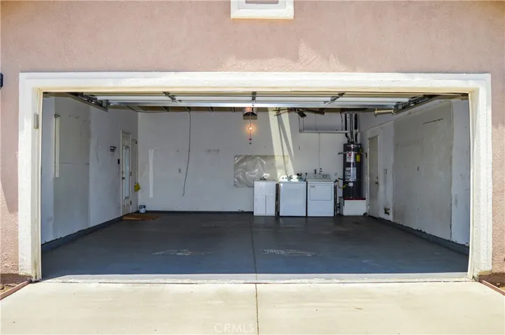 2-Car Garage with Opener, Washer, Dryer, Sink, Fan, Skylight, and Views of the Steel-Framed Construction and Radiant Heat Barrier Sheathing