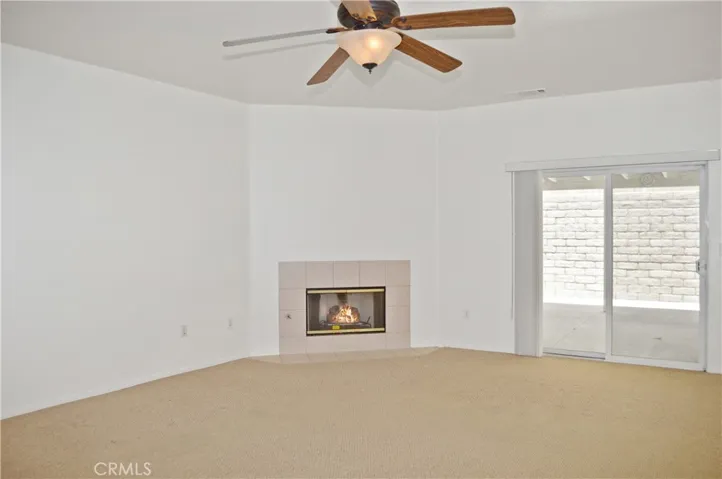 Cozy Fireplace, Ceiling Fan, Sliding Door to Expansive Covered Patio