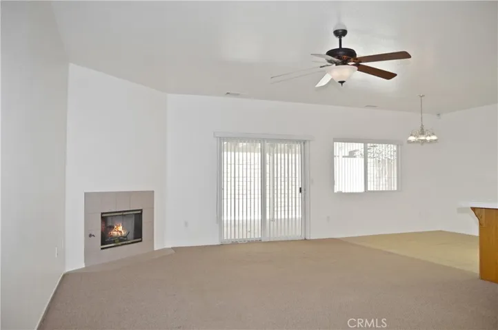 Cozy Fireplace, Ceiling Fan, Sliding Door to Expansive Covered Patio