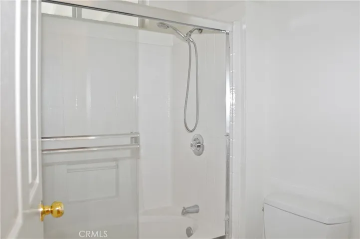 Main Bath with Dual Sinks, Privacy Door to Water Closet with Enclosed Tub/Shower Combo and Toilet