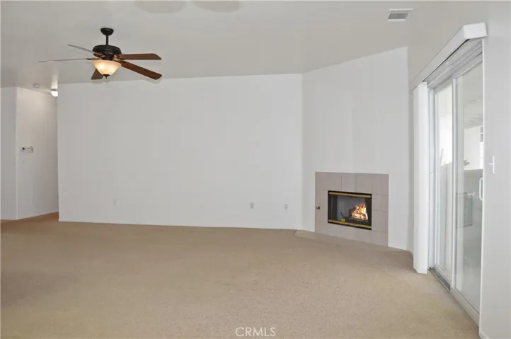 Cozy Fireplace, Ceiling Fan, Sliding Door to Expansive Covered Patio