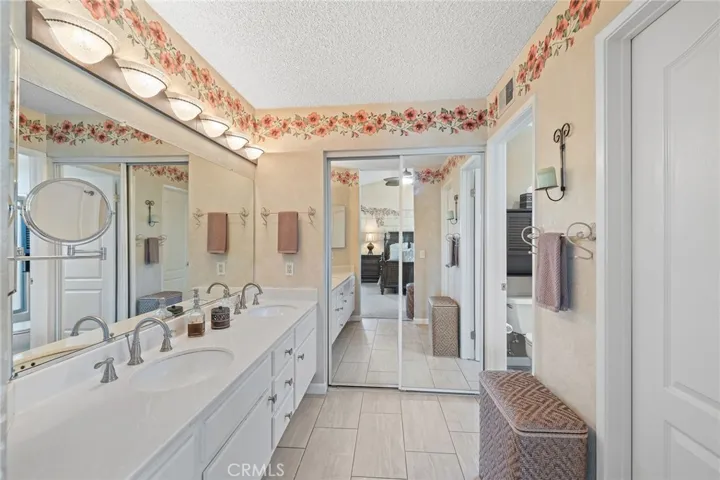 Large master bathroom with his and hers closets.