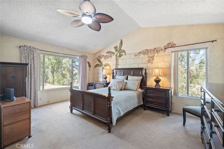 Large master bedroom with beautiful views.
