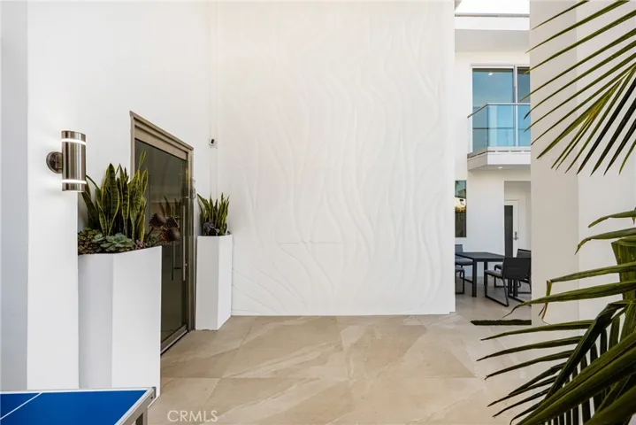 15' tall backlit wall front courtyard