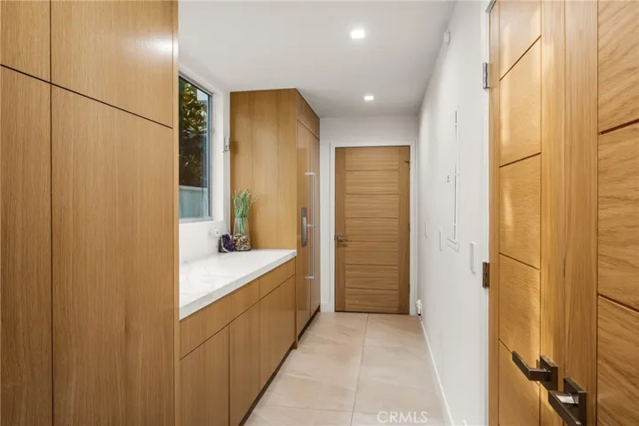 Butlers area- additional refrigerator- laundry behind door then garage