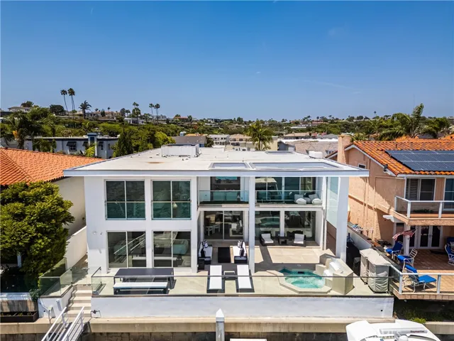 Large patio with spa on the waterfront