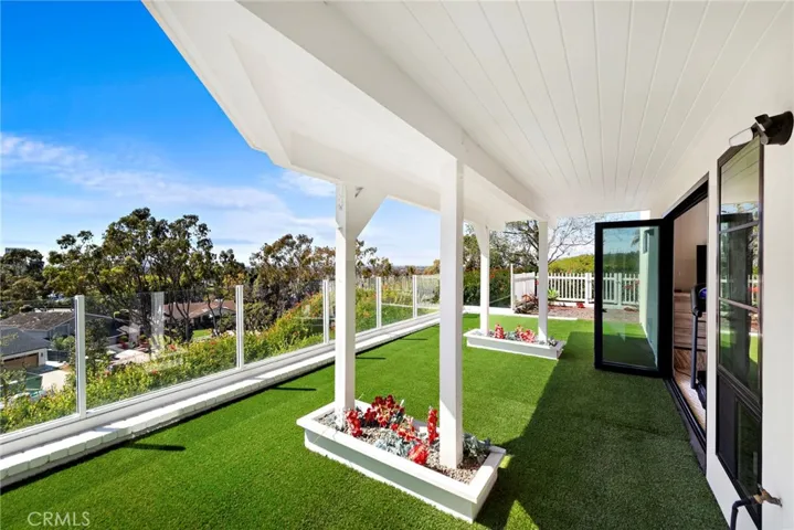 Back patio off of the master suite leads to the side-yard that is perfect for a vegetable & fruit garden.