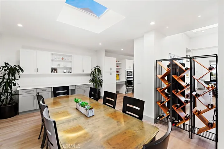 Formal dining room with a skylight.