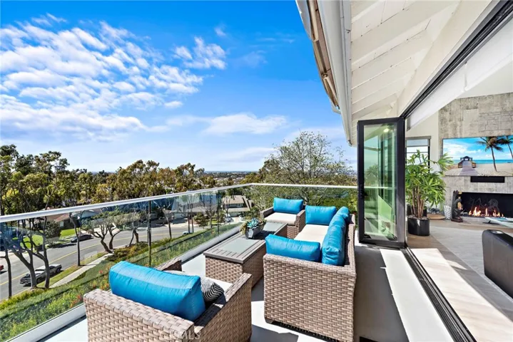 Beautiful and updated folding glass doors open to the deck for an indoor-outdoor living.