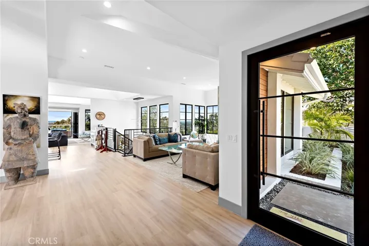 Formal entry foyer with a beautiful Pivot door.