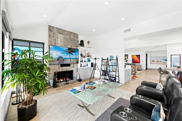 Family room boasts a fireplace, built-ins, overlooking the magnificent view.