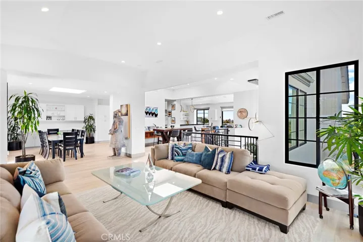 Formal living Rm across the formal dining Rm  with a skylight.