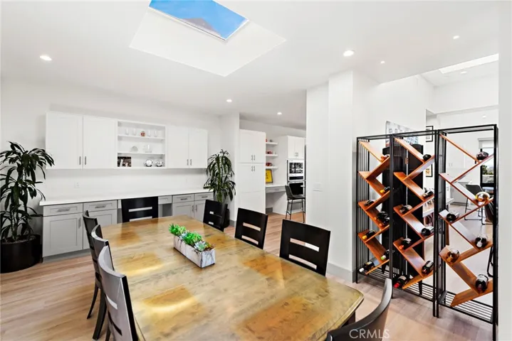 Formal dining room with a skylight.
