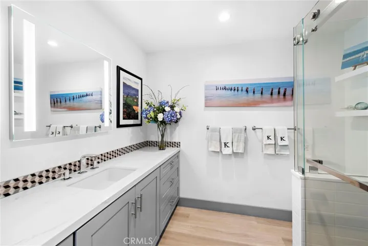 Main level bathroom oboasts a walk-in shower.