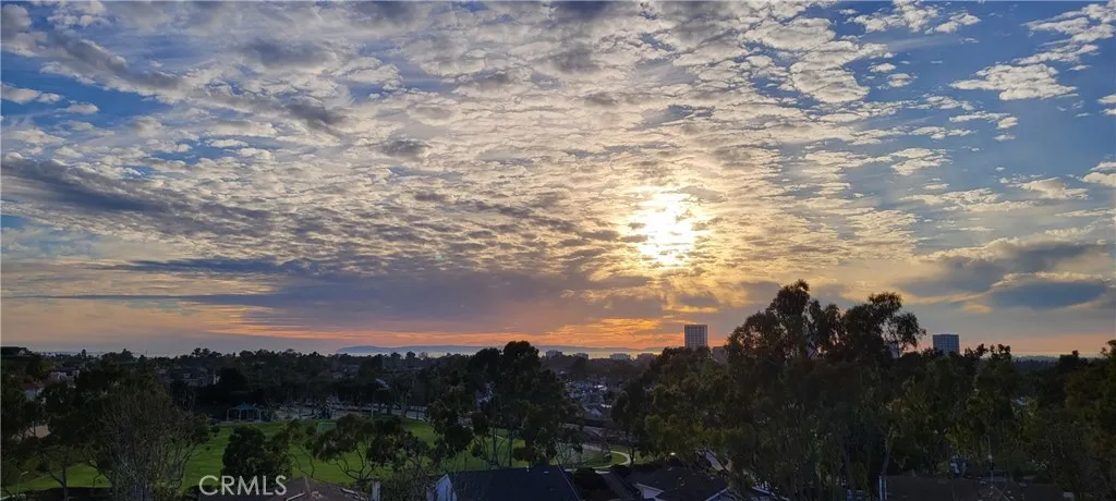 The breathtaking sunset view over the Catalina Island and Fashion Island mall can be seen from the great room, kitchen and the deck.