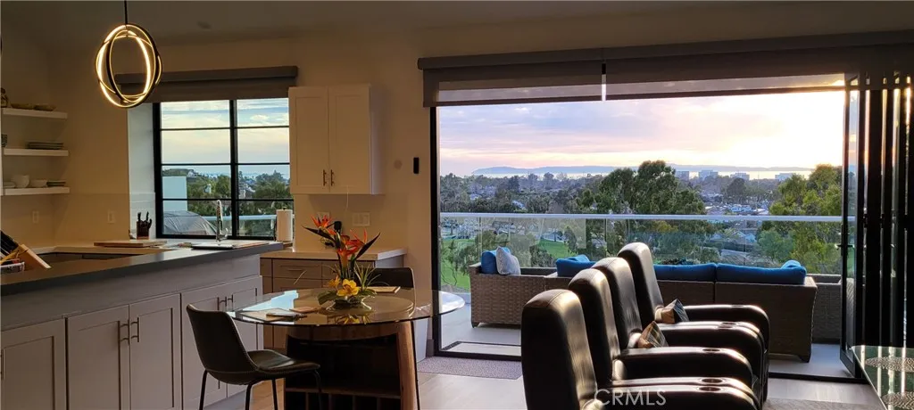 Enjoy breathtaking Catalina Island, ocean, park and sunset from the great room.