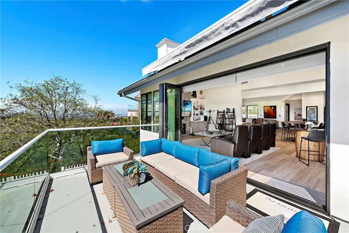 Remodeled folding doors provide a great indoor-outdoor living while entertaining.