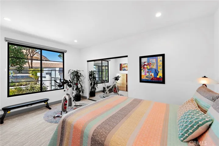 Main level guest bedroom overlooks the private courtyard.