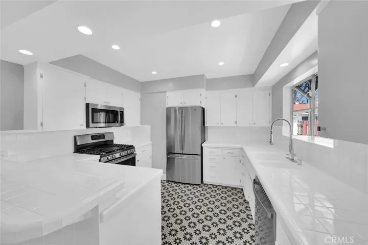 Kitchen With Newer Stainless Appliances.