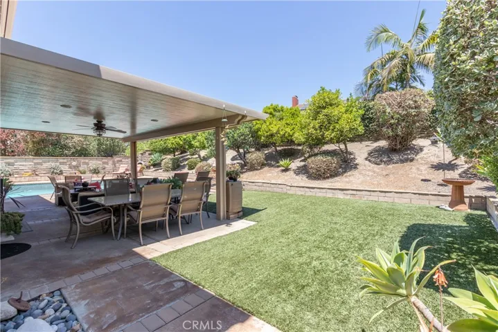 Turf lawn and lovely slope in back.