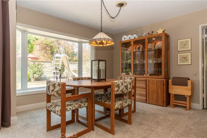 Elegant dining room with bay window.