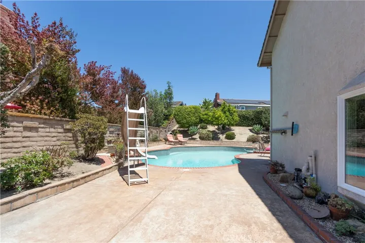Wide side yard area offers extra patio space.