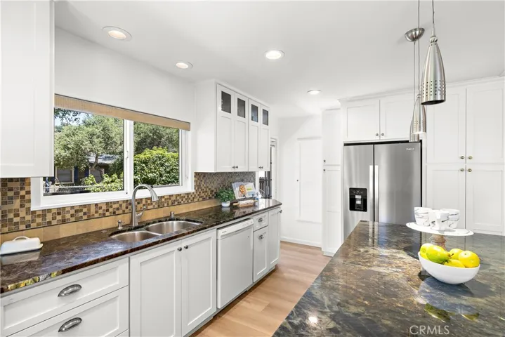 Beautiful Stone + Bronze Backsplash