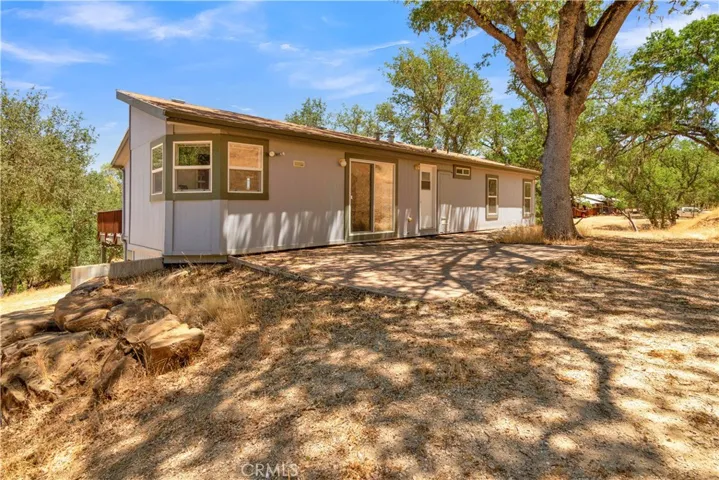Two-tiered level so can access main floor without stairs if desired. Multiple parking and RV parking areas.