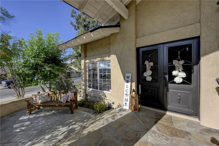 Beautiful custom iron front doors with windows that open for the afternoon breeze.